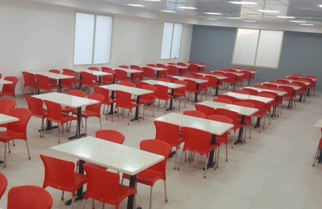Staff canteen furniture -  red polypropylene chairs and Durable tables