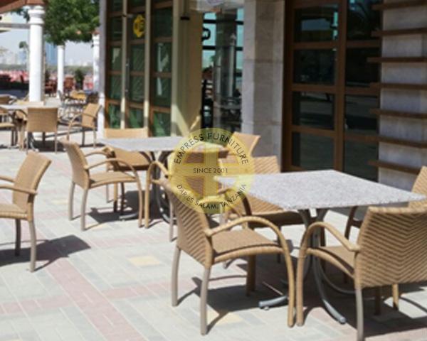 rattan chairs with outdoor tables in Ras Al Khaimah